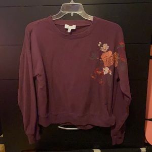 maroon sweatshirt with floral embroidery